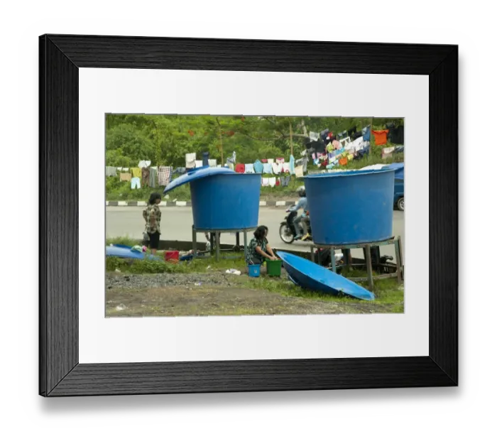 Framed Print : Refugees from recent volcanic eruption washing clothes beside big vats of water, Maguwo, Mount Merapi, Central Java Framed Print : Refugees from recent volcanic eruption washing clothes beside big vats of water, Maguwo, Mount Merapi, Central Java