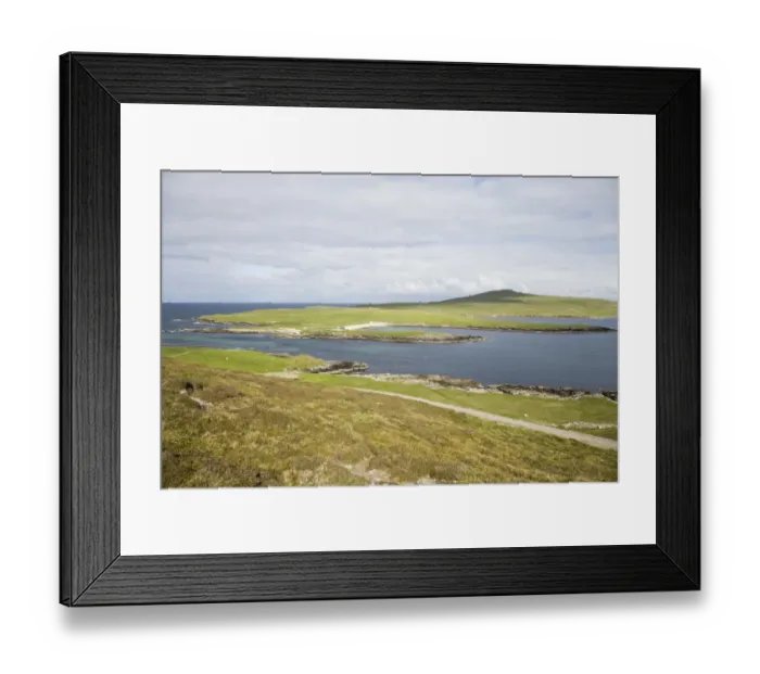 Framed Print : View of coastline with distant wardens house and ferry crossing, Noss from Bressay across Noss Sound, Shetland Islands Framed Print : View of coastline with distant wardens house and ferry crossing, Noss from Bressay across Noss Sound, Shetland Islands