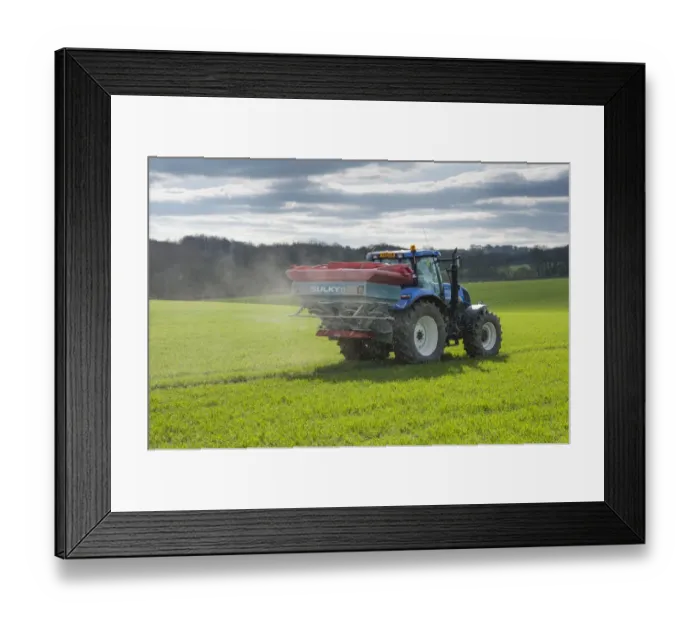 Framed Print : New Holland tractor with Sulky spreader, spreading fertilizer on arable crop, Wothersome, West Yorkshire, England Framed Print : New Holland tractor with Sulky spreader, spreading fertilizer on arable crop, Wothersome, West Yorkshire, England