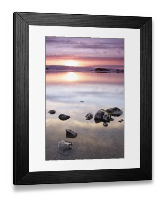 Framed Print : View of rocks in glacial lake at sunset after snowfall, Malham Tarn, Malhamdale, Yorkshire Dales N. P