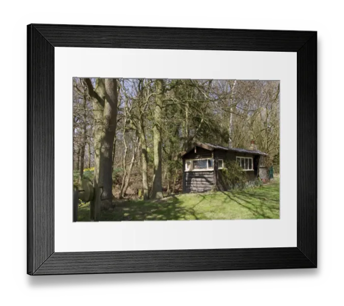 Framed Print : Old log cabin once used by woodsmen who maintained a mainly oak and hazel wood Framed Print : Old log cabin once used by woodsmen who maintained a mainly oak and hazel wood