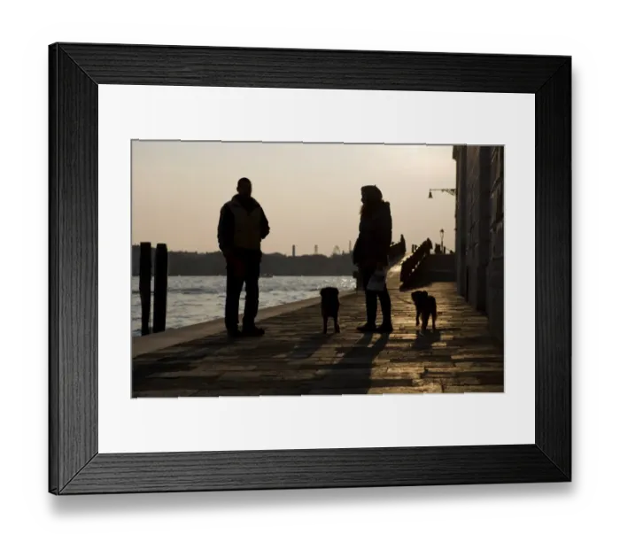Framed Print : Domestic Dog, woman owner taking two dogs for walk, talking to man at waterside silhouetted at sunset, Venice, Veneto Framed Print : Domestic Dog, woman owner taking two dogs for walk, talking to man at waterside silhouetted at sunset, Venice, Veneto