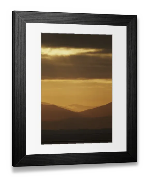 Framed Print : View across estuary towards distant hills at sunrise, looking towards Lake District (Cumbria, England), Solway Firth