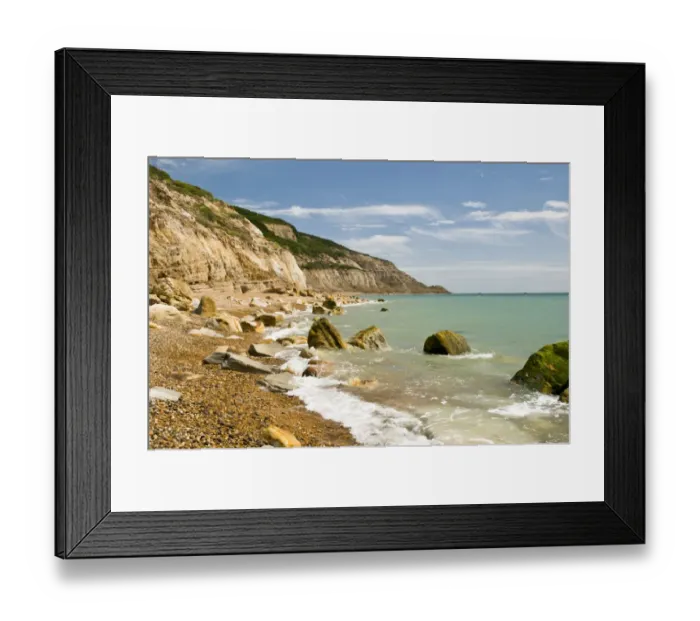 Framed Print : Rocks on beach and in sea under sandstone cliffs, Fairlight Cove, Covehurst Bay, near Hastings, East Sussex, England Framed Print : Rocks on beach and in sea under sandstone cliffs, Fairlight Cove, Covehurst Bay, near Hastings, East Sussex, England