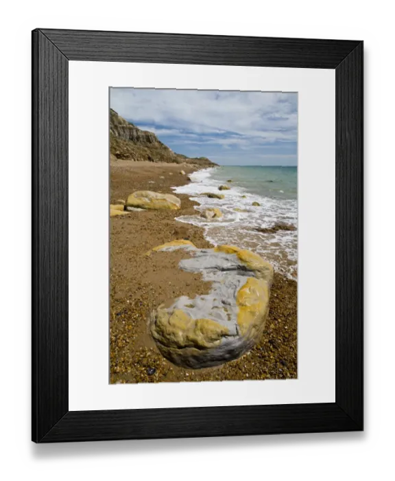 Framed Print : Rocks on beach and in sea under sandstone cliffs, Fairlight Cove, Covehurst Bay, near Hastings, East Sussex, England Framed Print : Rocks on beach and in sea under sandstone cliffs, Fairlight Cove, Covehurst Bay, near Hastings, East Sussex, England