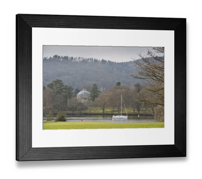 Framed Print : Boat sailing on lake beside island with 18th Century building, The Roundhouse, Belle Isle, Lake Windermere Framed Print : Boat sailing on lake beside island with 18th Century building, The Roundhouse, Belle Isle, Lake Windermere