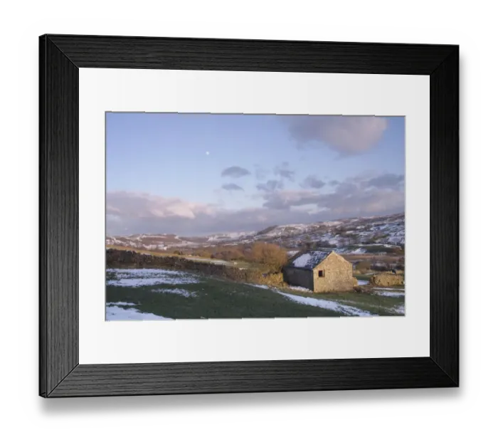 Framed Print : View of stone barn, drystone walls, grazing sheep, trees and River Swale in vallley bottom after snowfall Framed Print : View of stone barn, drystone walls, grazing sheep, trees and River Swale in vallley bottom after snowfall