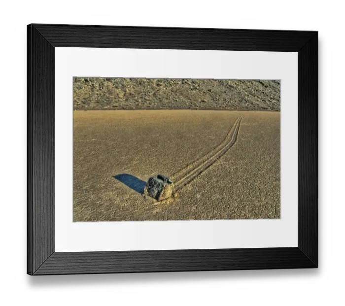 Framed Print : Sailing stones geological phenomenon of rocks moving along tracks on valley floor Framed Print : Sailing stones geological phenomenon of rocks moving along tracks on valley floor