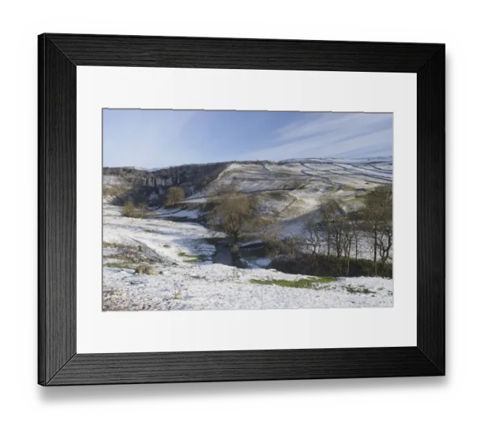 Framed Print : View of curved limestone cliff at head of valley, with stream flowing from base of cliff in snow, Malham Cove Framed Print : View of curved limestone cliff at head of valley, with stream flowing from base of cliff in snow, Malham Cove
