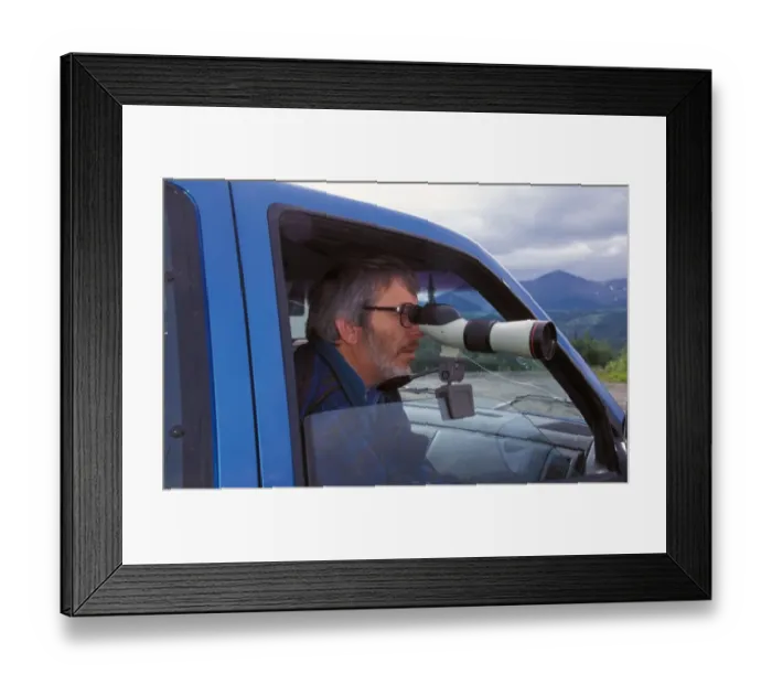 Framed Print : Birdwatching Derek Moore using a Nikon Telescope Framed Print : Birdwatching Derek Moore using a Nikon Telescope