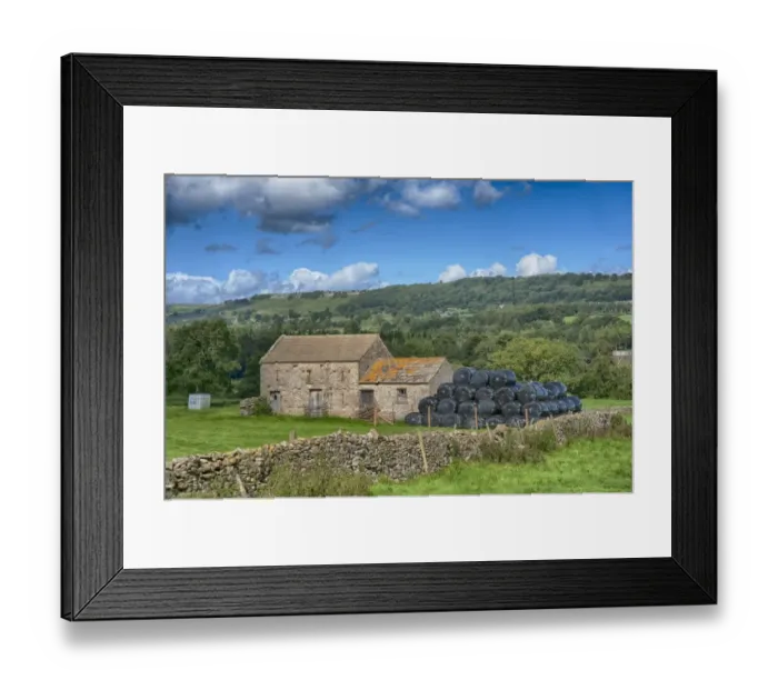 Framed Print : View of pasture, drystone wall, stone field barn and large black bales of silage, Leyburn, North Yorkshire, England Framed Print : View of pasture, drystone wall, stone field barn and large black bales of silage, Leyburn, North Yorkshire, England