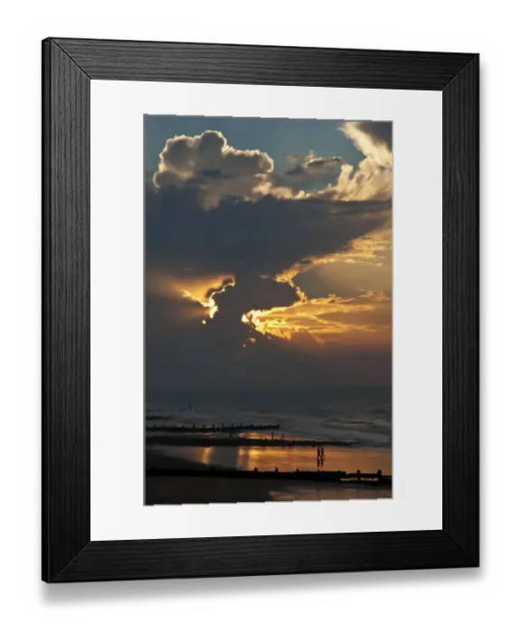 Framed Print : View of people on beach, groynes and clouds at sunset, Cromer, Norfolk, England, July Framed Print : View of people on beach, groynes and clouds at sunset, Cromer, Norfolk, England, July