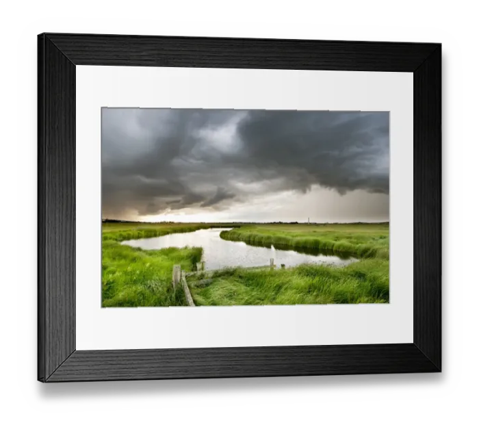 Framed Print : Stormclouds over pool in coastal grazing marsh habitat, Elmley Marshes National Nature Reserve, Isle of Sheppey, Kent Framed Print : Stormclouds over pool in coastal grazing marsh habitat, Elmley Marshes National Nature Reserve, Isle of Sheppey, Kent
