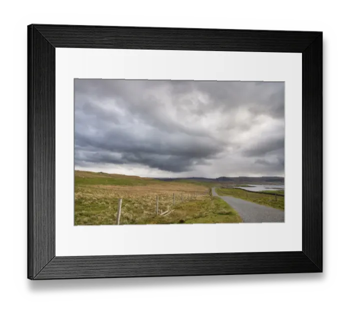Framed Print : Approaching stormclouds over single track road and coastline, Lunna Ness, Mainland, Shetland Islands, Scotland, June Framed Print : Approaching stormclouds over single track road and coastline, Lunna Ness, Mainland, Shetland Islands, Scotland, June