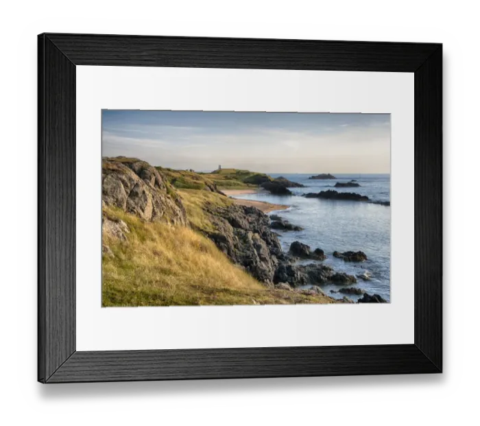 Framed Print : View of rocky coastline and beach on tidal island, Llanddwyn Island, Newborough Warren National Nature Reserve Framed Print : View of rocky coastline and beach on tidal island, Llanddwyn Island, Newborough Warren National Nature Reserve