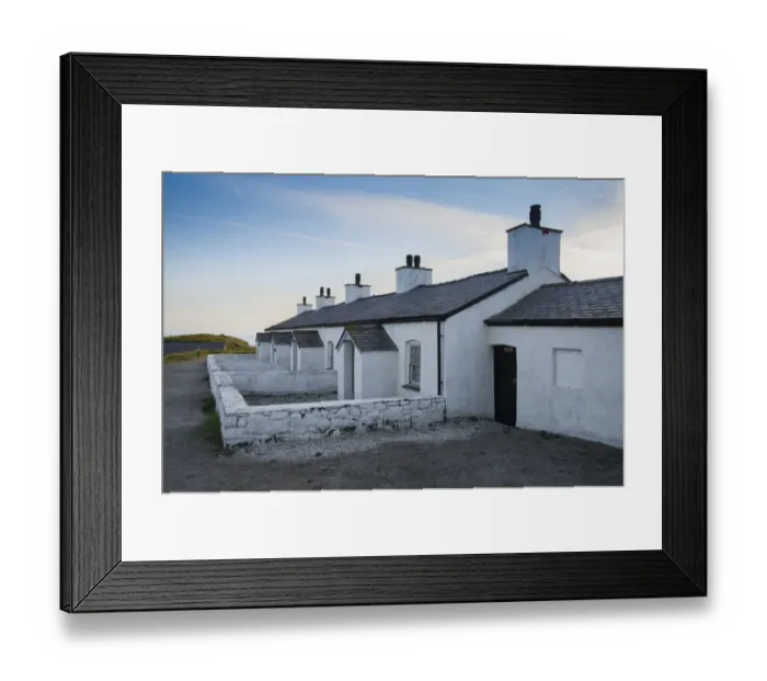 Framed Print : Pilot cottages used to service pilot boats and lifeboats on tidal island, Llanddwyn Island