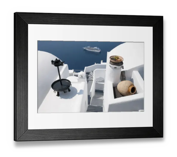 Framed Print : White-washed villa hotel building and cruise ship at sea, Fira, Santorini, Cyclades, Aegean Sea, Greece, September