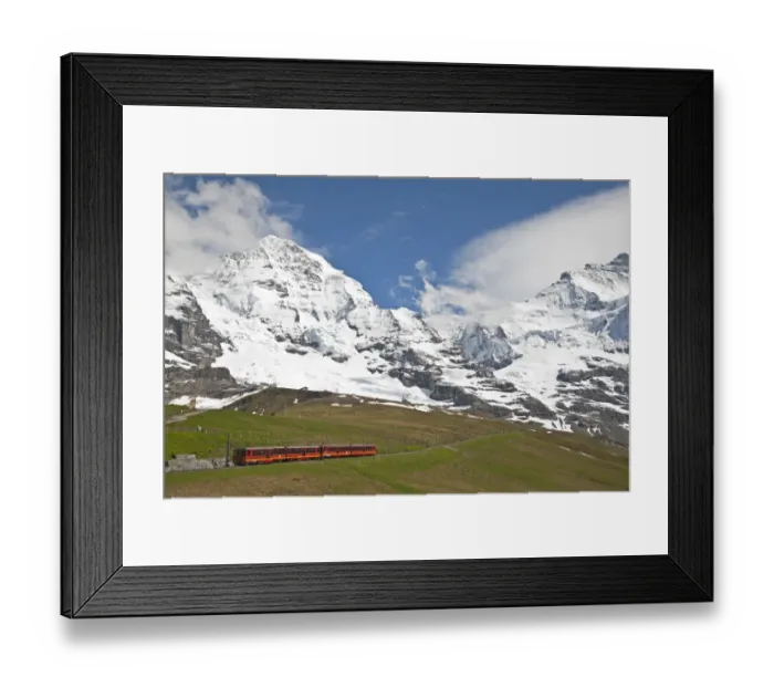 Framed Print : Jungfraubahn train leaving Kleine Scheidegg towards Jungfraujoch, Monch mountain in background, Bernese Alps