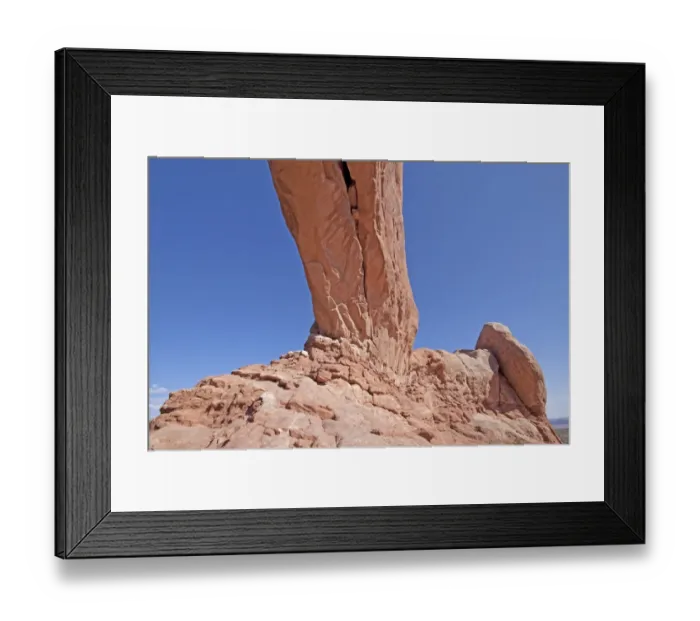 Framed Print : Looking up at the arch of North Window at Arches National Park. These arches are made from Entrada Sandstone which over