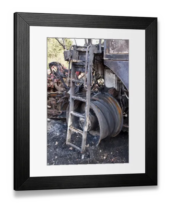 Framed Print : The remains of a burnt out sugar beat harvester