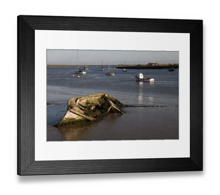 Framed Print : Decaying old boat on mud in The River Alde by Orford, looking east over Orford Ness, Suffolk Framed Print : Decaying old boat on mud in The River Alde by Orford, looking east over Orford Ness, Suffolk