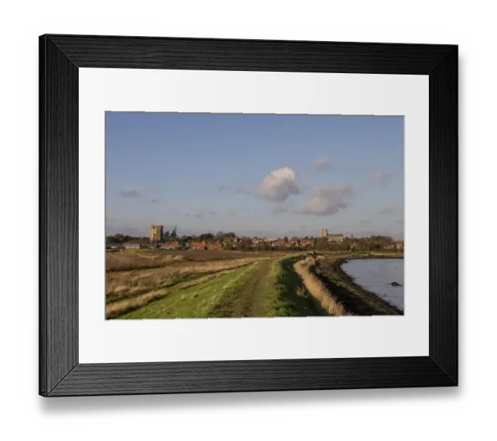 Framed Print : Footpath on the sea wall looking over the village of Orford with its Norman castle and church, Suffolk Framed Print : Footpath on the sea wall looking over the village of Orford with its Norman castle and church, Suffolk