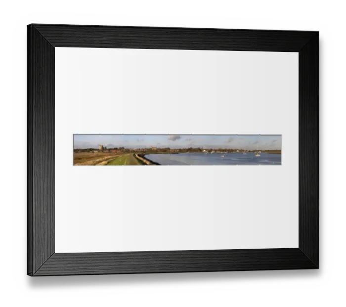 Framed Print : Looking along the sea wall toward Orford showing Orford castle and church, boats on the River Alde Framed Print : Looking along the sea wall toward Orford showing Orford castle and church, boats on the River Alde