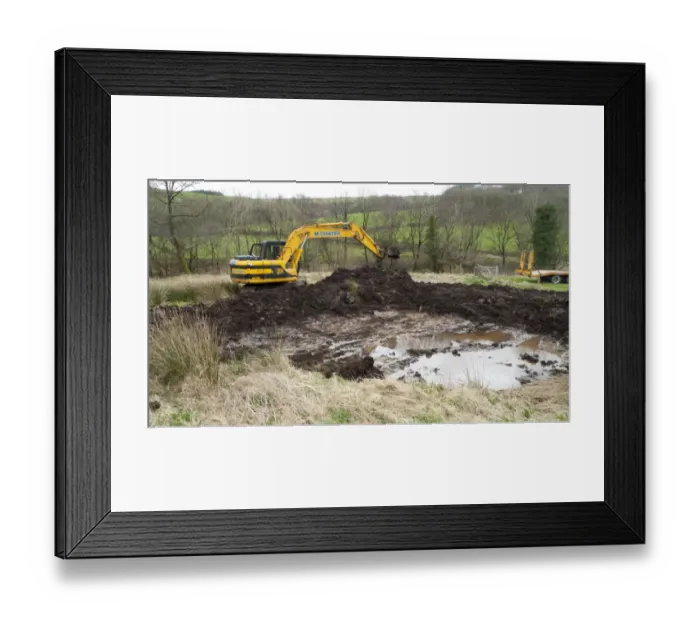 Framed Print : Contractor with 360degree excavator, digging wildlife pond on farm, Powys, Wales, April Framed Print : Contractor with 360degree excavator, digging wildlife pond on farm, Powys, Wales, April