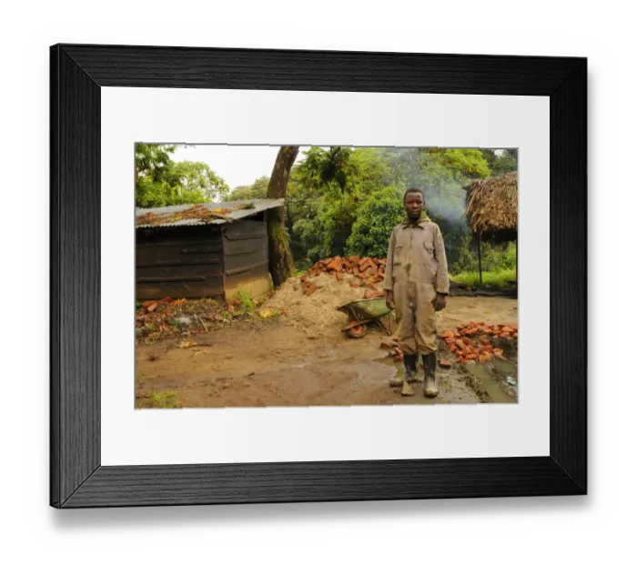 Framed Print : Child building houses in village on park border, Kahuzi-Biega N. P. Kivu Region, Democratic Republic of Congo, november Framed Print : Child building houses in village on park border, Kahuzi-Biega N. P. Kivu Region, Democratic Republic of Congo, november