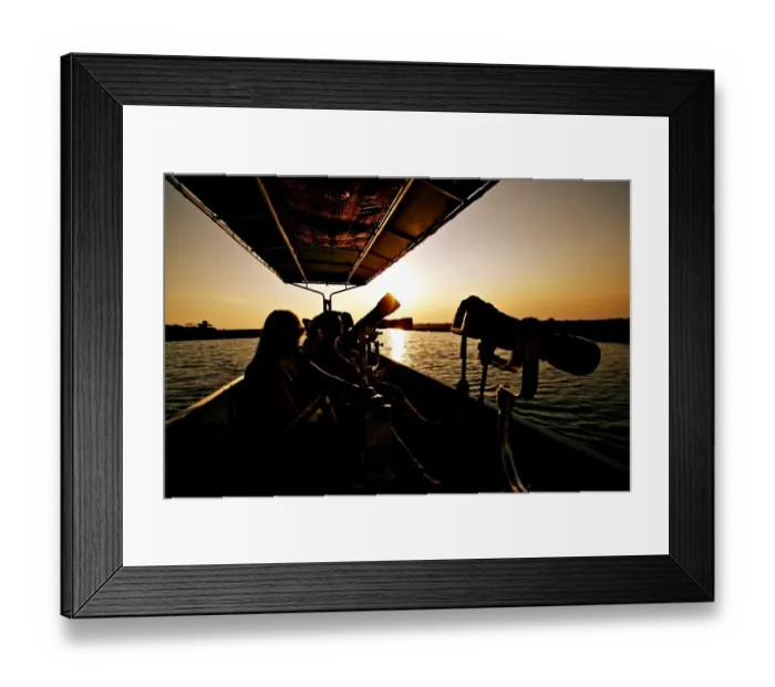 Framed Print : Wildlife photographers on boat, silhouetted at sunset, Chobe River, Chobe N. P. Botswana, July Framed Print : Wildlife photographers on boat, silhouetted at sunset, Chobe River, Chobe N. P. Botswana, July