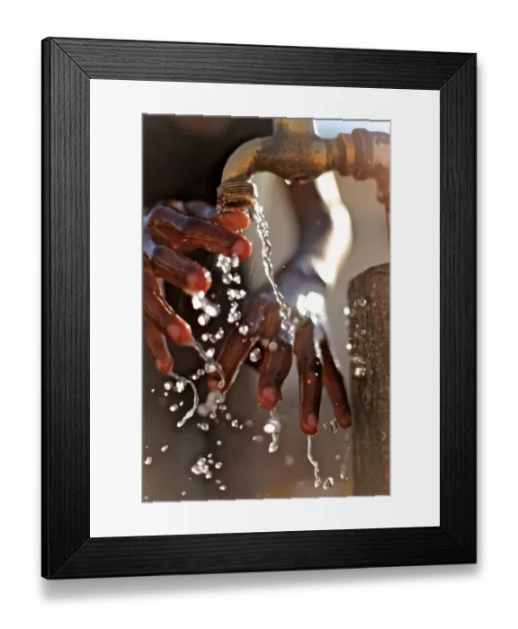 Framed Print : Close-up of hands under tap, Maun, Botswana, July Framed Print : Close-up of hands under tap, Maun, Botswana, July