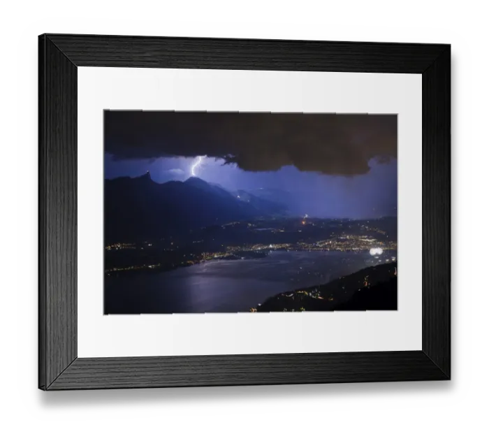 Framed Print : Thunderstorm with lightning and fireworks over city and lake at night, Thun, Lake Thun, Swiss Alps, Bernese Oberland Framed Print : Thunderstorm with lightning and fireworks over city and lake at night, Thun, Lake Thun, Swiss Alps, Bernese Oberland