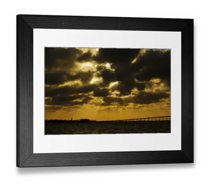 Framed Print : View of sunbeams over coast at sunset, with bridge to South Padre Island, Port Isabel, Texas, U. S. A. april Framed Print : View of sunbeams over coast at sunset, with bridge to South Padre Island, Port Isabel, Texas, U. S. A. april