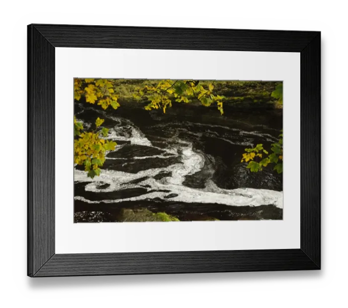 Framed Print : Swirling patterns of foam in river just below waterfall, caused by nutrients released from decaying vegetation Framed Print : Swirling patterns of foam in river just below waterfall, caused by nutrients released from decaying vegetation