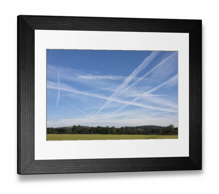 Framed Print : Condensation trails in sky, artificial clouds formed behind aircraft, Singleton, Chichester, West Sussex, England Framed Print : Condensation trails in sky, artificial clouds formed behind aircraft, Singleton, Chichester, West Sussex, England