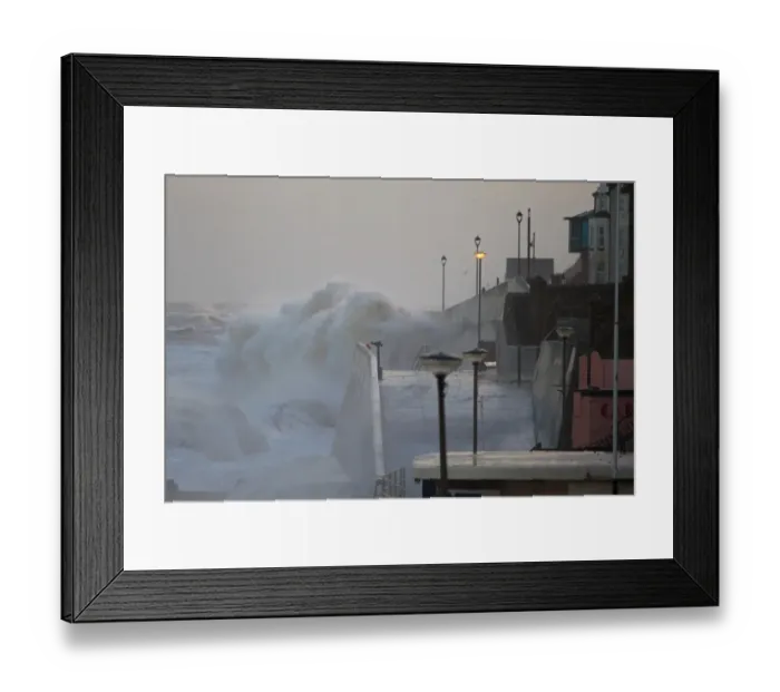 Framed Print : Waves crashing against seawall of seaside town during tidal surge, Sheringham, North Norfolk, England, December 2013