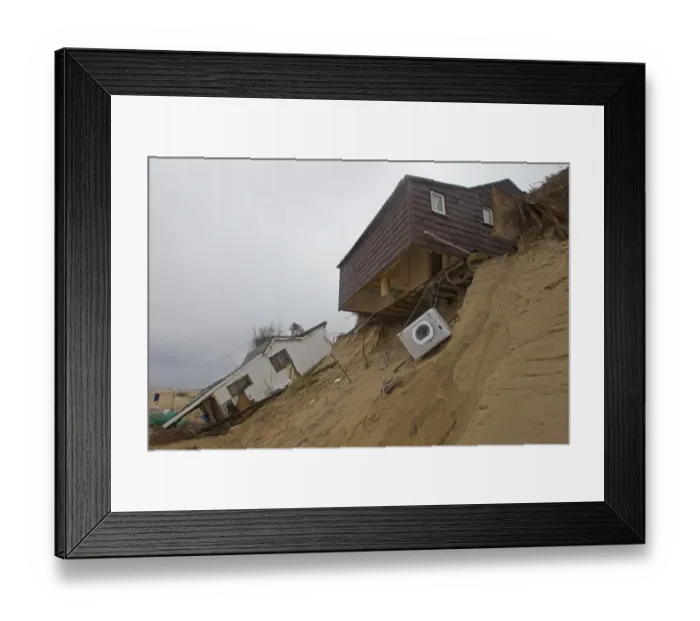 Framed Print : Eroded sea cliffs and damaged chalets after December 2013 tidal surge, Hemsby, Norfolk, England, January