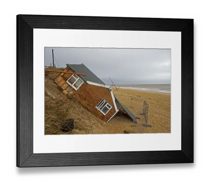 Framed Print : Eroded sea cliffs and damaged chalet after December 2013 tidal surge, Hemsby, Norfolk, England, January Framed Print : Eroded sea cliffs and damaged chalet after December 2013 tidal surge, Hemsby, Norfolk, England, January