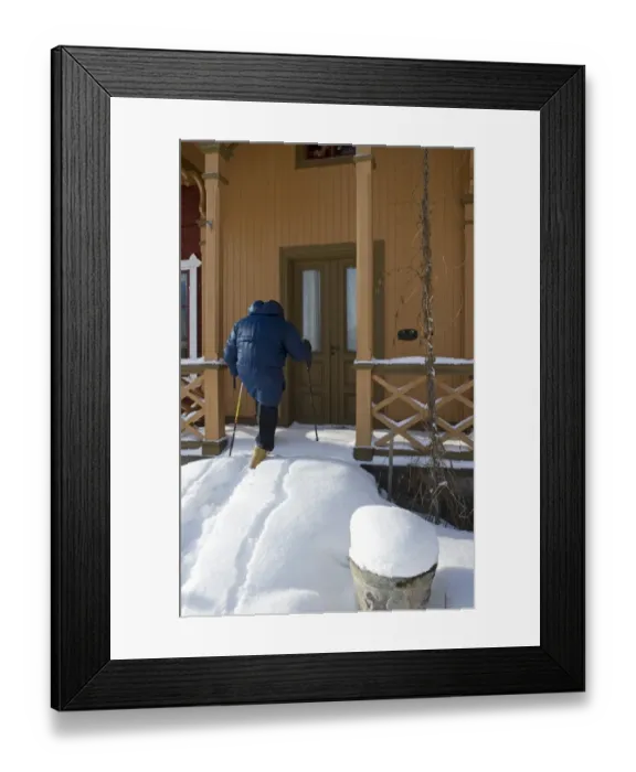 Framed Print : Person walking up snow covered steps to house door, Sweden, february Framed Print : Person walking up snow covered steps to house door, Sweden, february