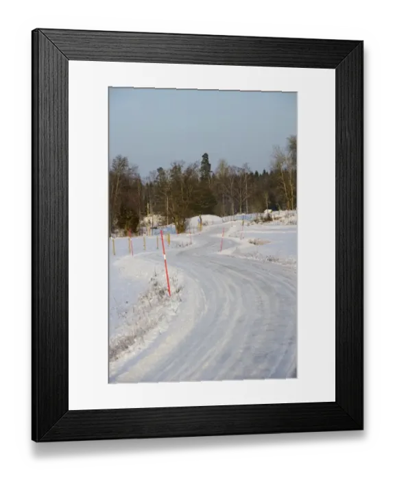 Framed Print : Snow covered road with markers, Sweden, february