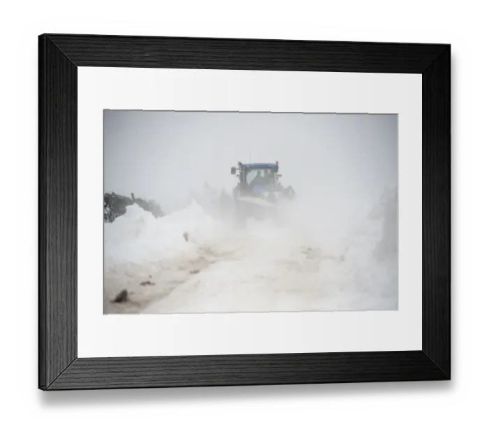 Framed Print : New Holland tractor clearing snow off rural road after snowstorm, Cumbria, England, March Framed Print : New Holland tractor clearing snow off rural road after snowstorm, Cumbria, England, March