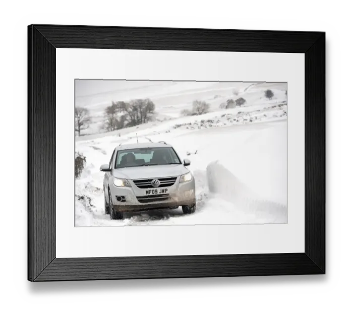 Framed Print : Volkswagen Tiguan 4x4 travelling along rural road after snowstorm, Cumbria, England, March Framed Print : Volkswagen Tiguan 4x4 travelling along rural road after snowstorm, Cumbria, England, March