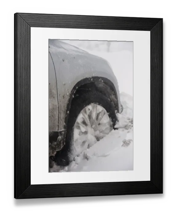 Framed Print : Close-up of car wheel stuck in snowdrift after snowstorm, Cumbria, England, March Framed Print : Close-up of car wheel stuck in snowdrift after snowstorm, Cumbria, England, March