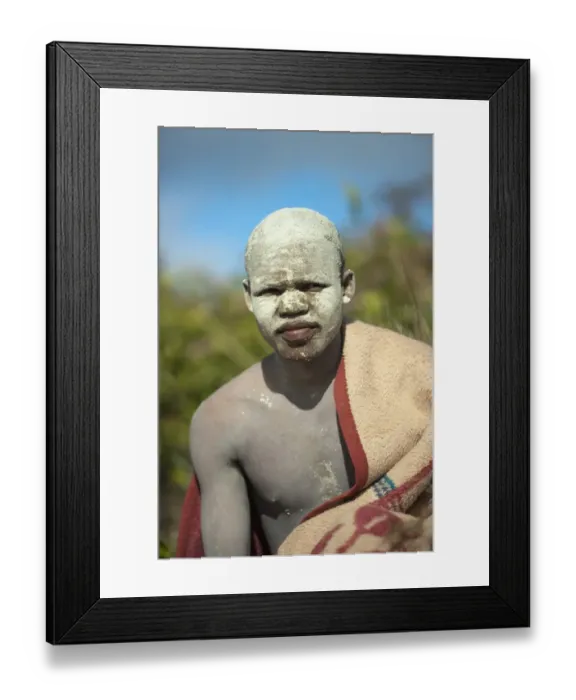 Framed Print : AmaPondo (Xhosa) boy wrapped in rugs with white clay (I-Futa) on face, after being circumcised (uku-Lukwa) Framed Print : AmaPondo (Xhosa) boy wrapped in rugs with white clay (I-Futa) on face, after being circumcised (uku-Lukwa)