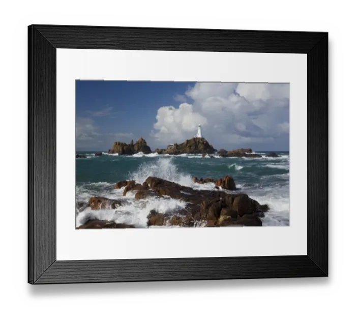 Framed Print : Rocky coastline with lighthouse in background, La Corbiere Lighthouse, La Corbiere, St Framed Print : Rocky coastline with lighthouse in background, La Corbiere Lighthouse, La Corbiere, St