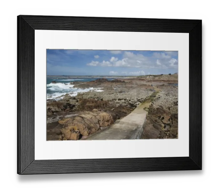 Framed Print : View of causeway over rocky shore at low tide, La Corbiere, St. Brelade, Jersey, Channel Islands, May Framed Print : View of causeway over rocky shore at low tide, La Corbiere, St. Brelade, Jersey, Channel Islands, May
