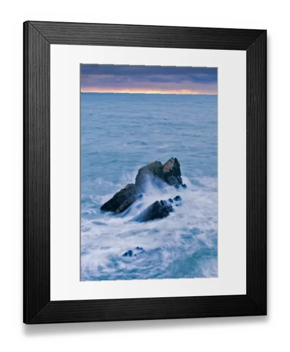 Framed Print : Large rock lashed by waves in stormy sea at sunset, Hartland, North Devon, England, October Framed Print : Large rock lashed by waves in stormy sea at sunset, Hartland, North Devon, England, October
