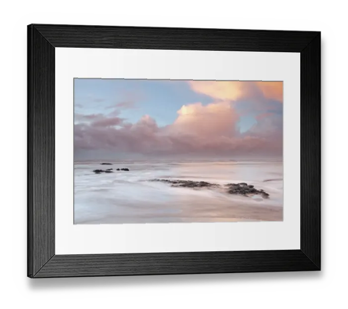Framed Print : Rocks on beach disappearing under incoming tide at sunset, Westward Ho!, North Devon, England, December Framed Print : Rocks on beach disappearing under incoming tide at sunset, Westward Ho!, North Devon, England, December
