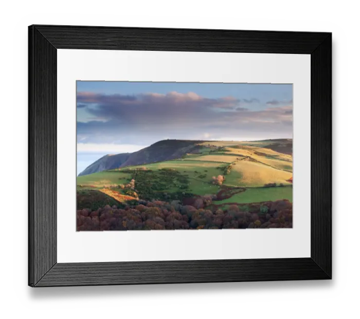 Framed Print : View of hill near coast lit by early morning sunlight, with Foreland Point in distance, Wind Hill, near Lynmouth Framed Print : View of hill near coast lit by early morning sunlight, with Foreland Point in distance, Wind Hill, near Lynmouth