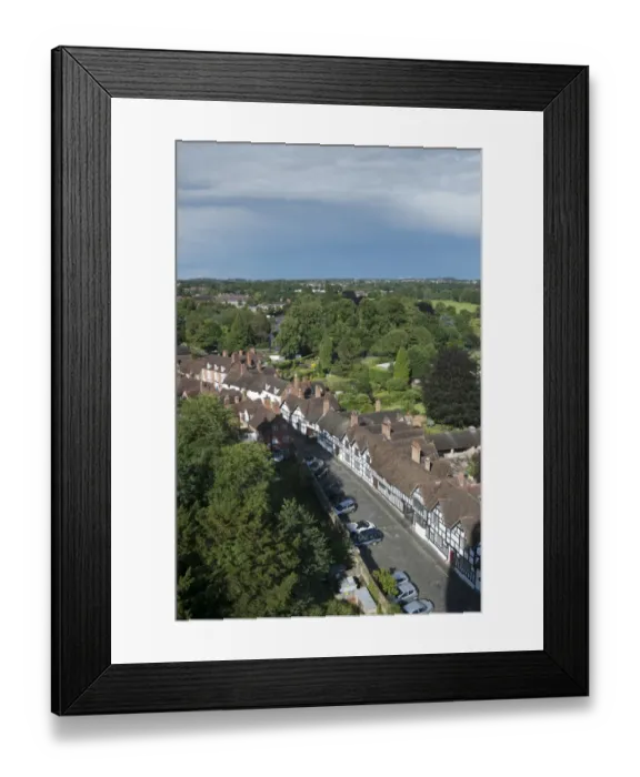 Framed Print : View from castle overlooking trees and town with old Tudor timber-framed buildings lining street, Warwick Castle Framed Print : View from castle overlooking trees and town with old Tudor timber-framed buildings lining street, Warwick Castle